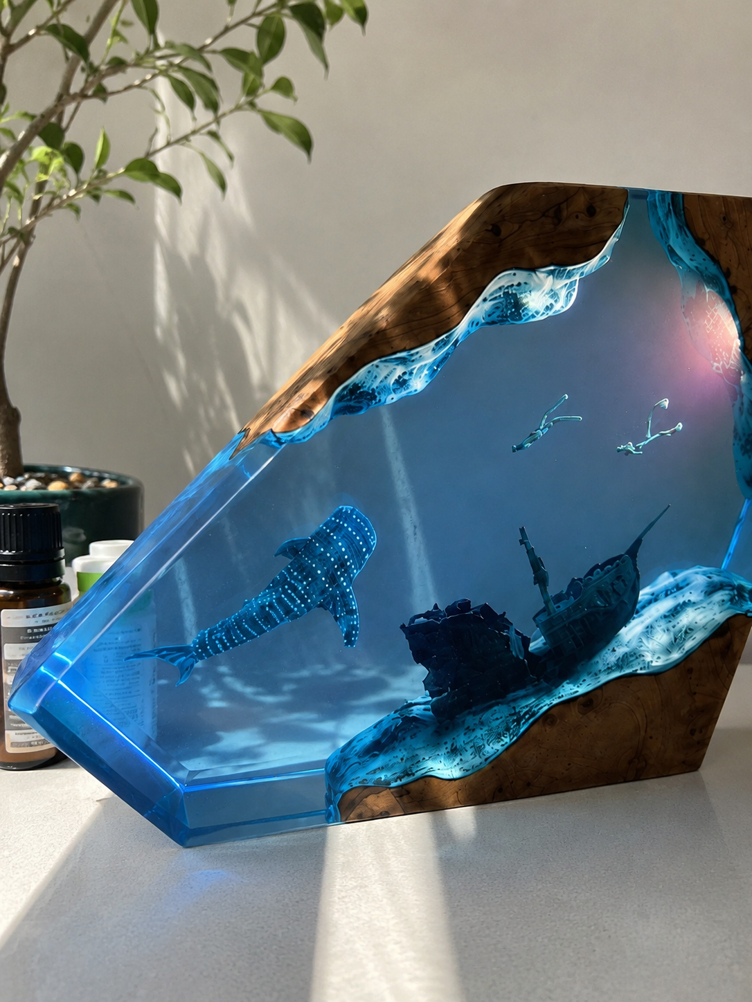 Ocean resin artwork displayed on a desk