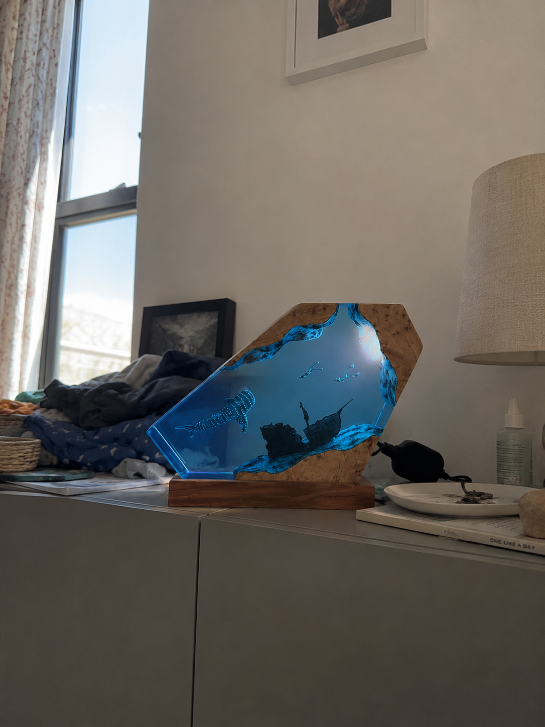 Ocean resin artwork in a curated home setting
